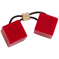 LOUIS VUITTON Burnt Red Elastic Gold LV Hair Cubes at 1stDibs  louis  vuitton hair cubes, lv hair tie, louis vuitton hair tie