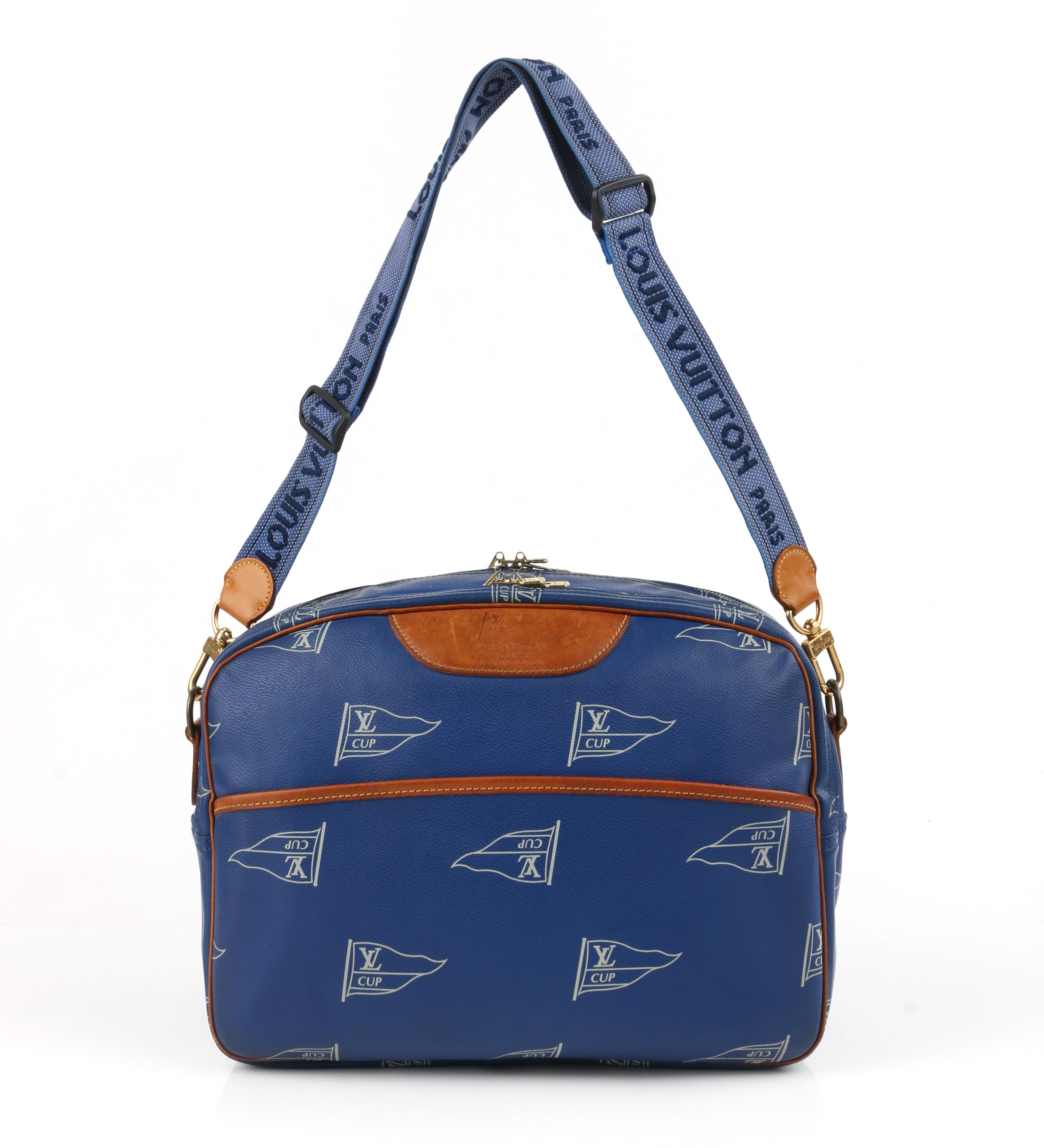 LOUIS VUITTON c.1992 LV America’s Cup Sailing Messenger Shoulder Bag LTD ED
 
Circa: c.1992
Labels: Louis Vuitton
Style: Messenger bag, shoulder bag
Color(s): Shades of blue, white and tan
Lined: No
Unmarked Fabric Content: Coated canvas;