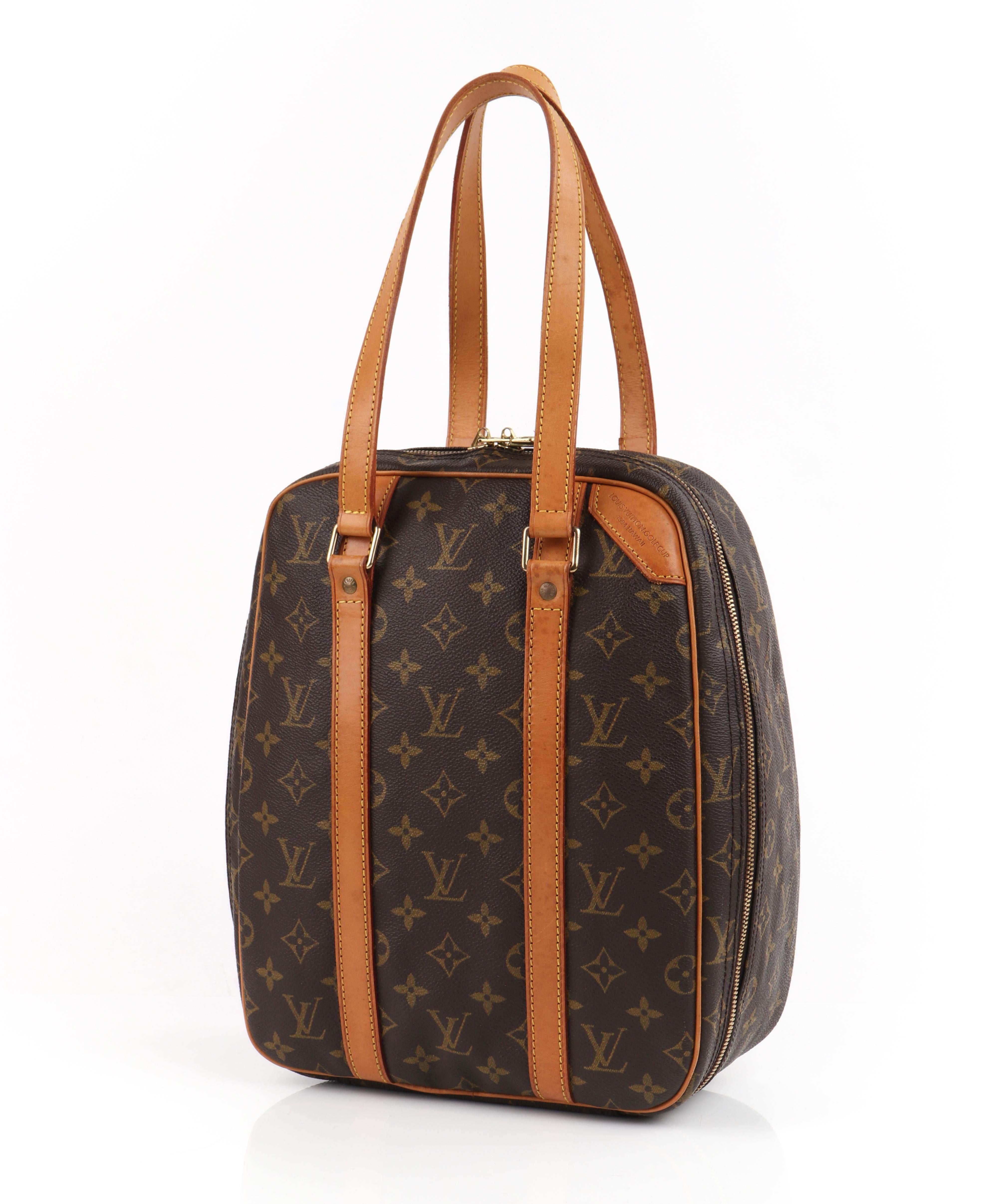 LOUIS VUITTON c.1994 Limited Edition Golf Cup Hawaii LV Monogram Excursion/Golf Shoe Bag
 
Brand / Manufacturer: Louis Vuitton
Collection: c.1994
Style: Top handle zip bag
Color(s): Multi
Lined: No
Unmarked Fabric Content: Coated canvas & leather