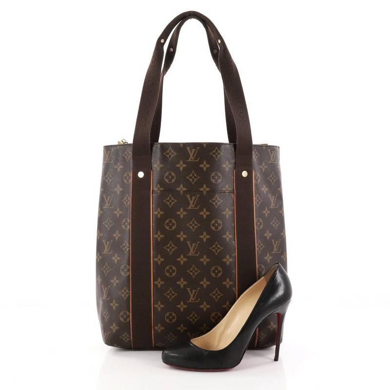 This authentic Louis Vuitton Cabas Beaubourg Monogram Canvas showcase a classic tote design perfect for everyday use. Crafted from the brand's iconic brown monogram coated canvas, this tote features dual flat canvas handles with Louis Vuitton names,