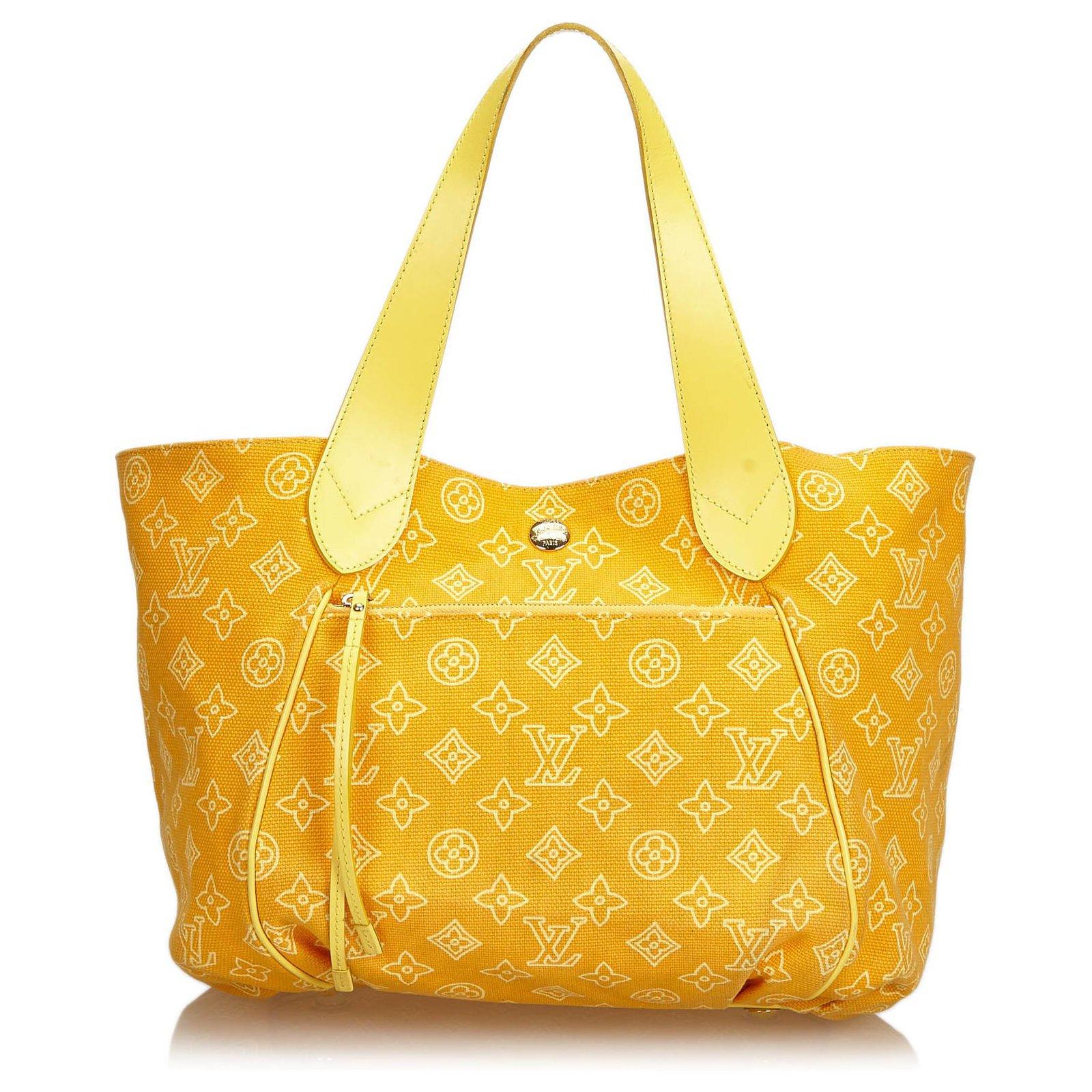 The Cabas Ipanema features a canvas body, exterior front zip pocket, flat leather straps, open top with hook closure, and interior zip pockets. 
The must-have tote for Summer 2009, Cabas Ipanema combines comfort and versatility, it would sure look