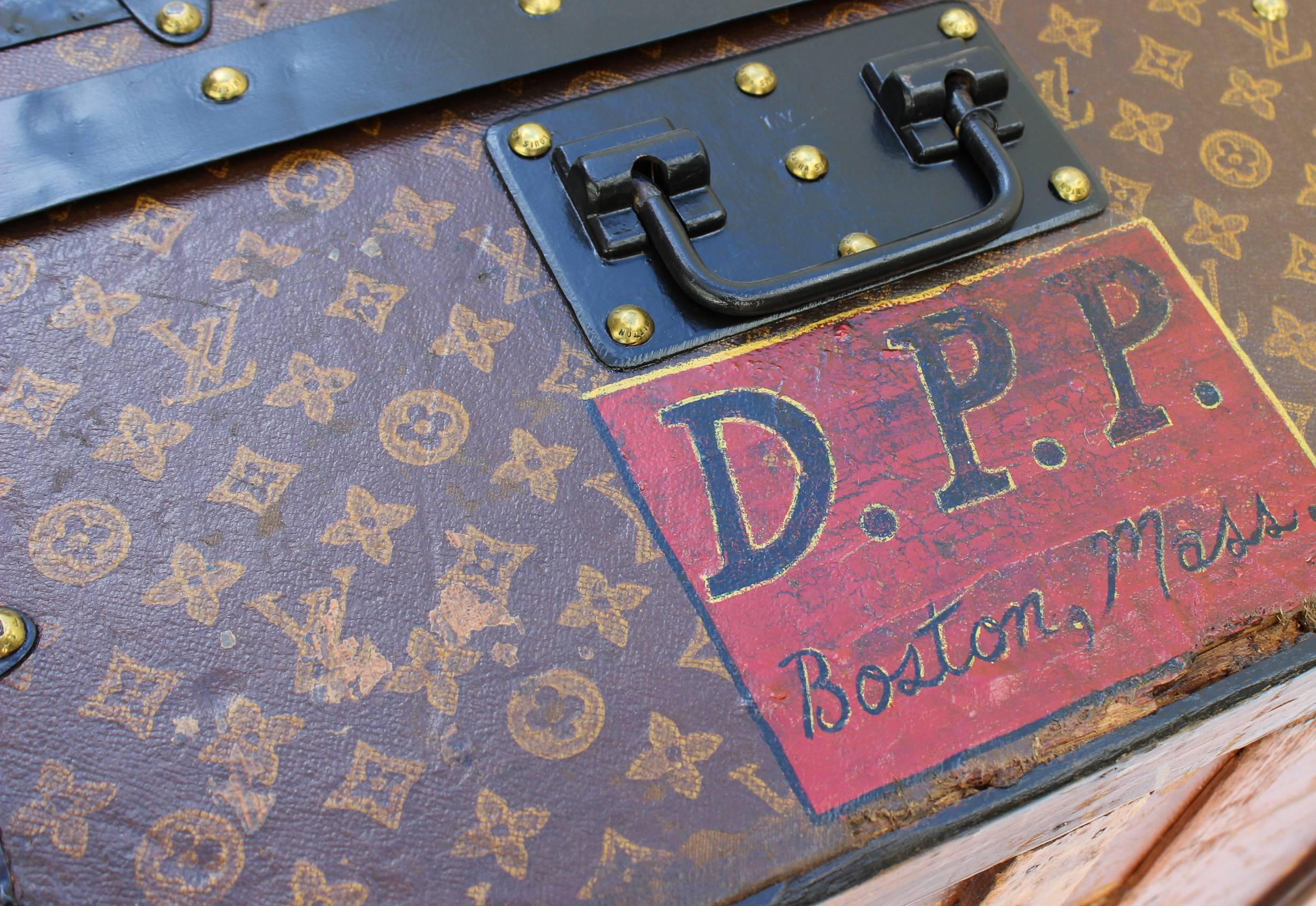 A fine example of a Louis Vuitton Cabin Trunk featuring the hand-stencilled LV monogram design first introduced in 1896. Black mental trim and corners contrast beautifully with the brass central lock, side enclosures and studs all inscribed with
