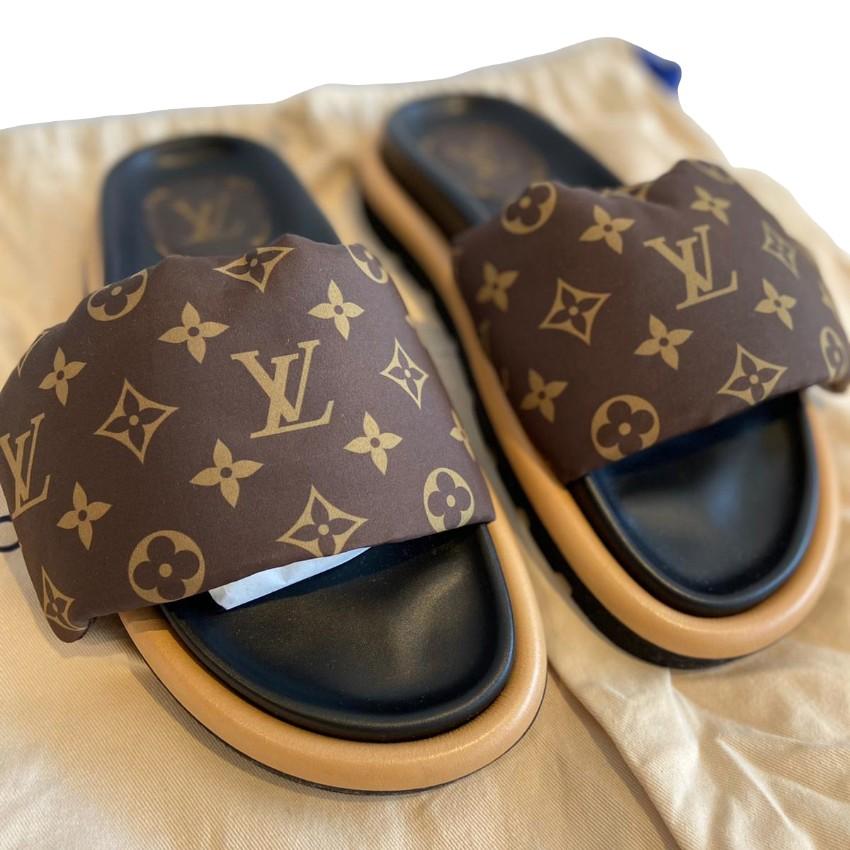 Louis Vuitton Cacao Brown Leather Monogram Pool Pillow Comfort Mules
 

 - Wide padded front strap in Monogram nylon with a soft down filling
 - Black leather footbed, with a contrast nappa leather outsole
 - Thick rubber tread sole
 

 Materials:
