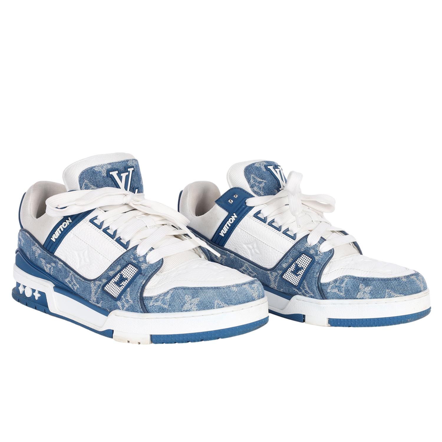 Authentic Louis Vuitton Calfskin Embossed Monogram Denim Mens LV Trainer Sneakers in  Blue

Mens Size: 8.5

Color: White/Blue Denim

These stylish sneakers feature white leather and monogram denim. The tongue displays the LV logo as well as the heel