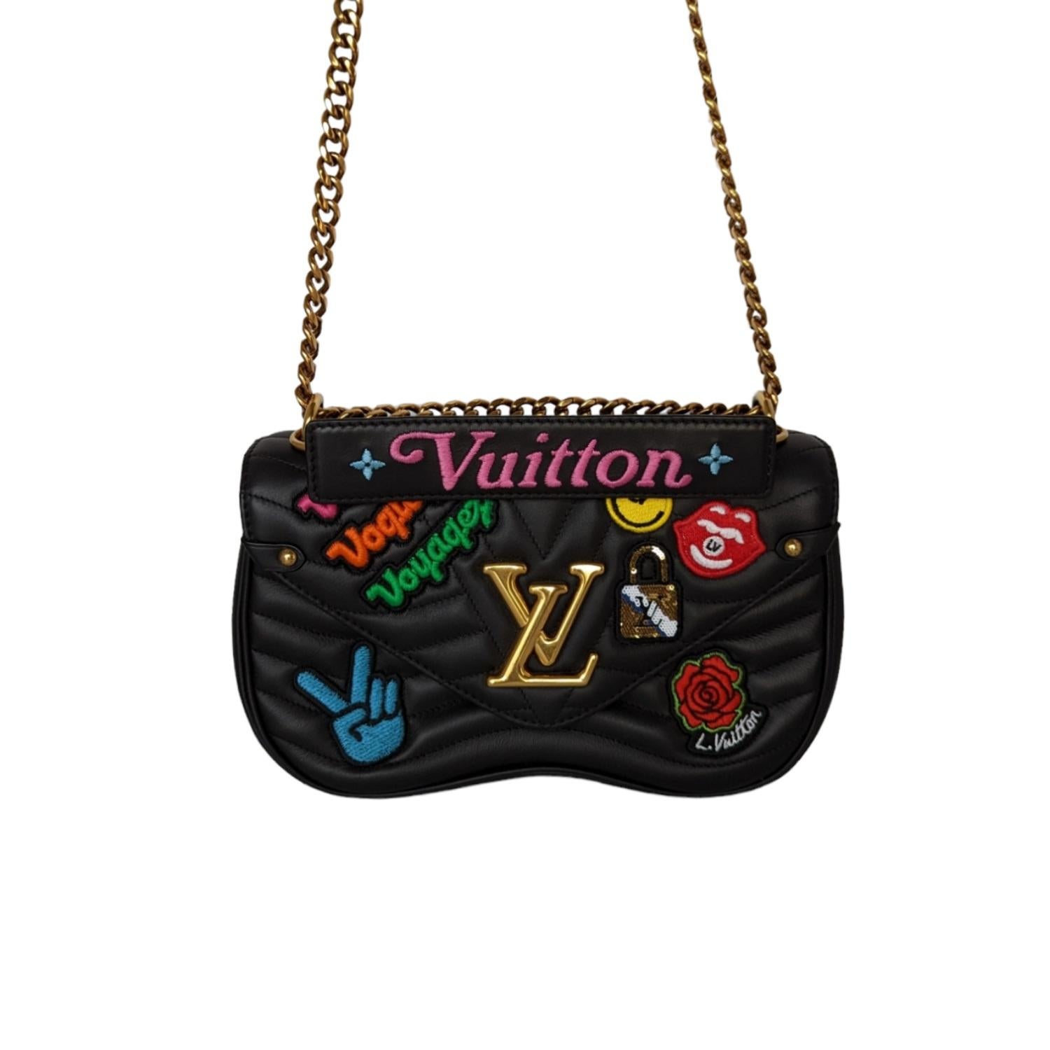This chic handbag is crafted of smooth calfskin leather in black. The bag features a detachable handle signed “Louis Vuitton,” edgy hardware with an aged gold finish, colorful patches and a sliding chain adjusts the drop for long/short for shoulder