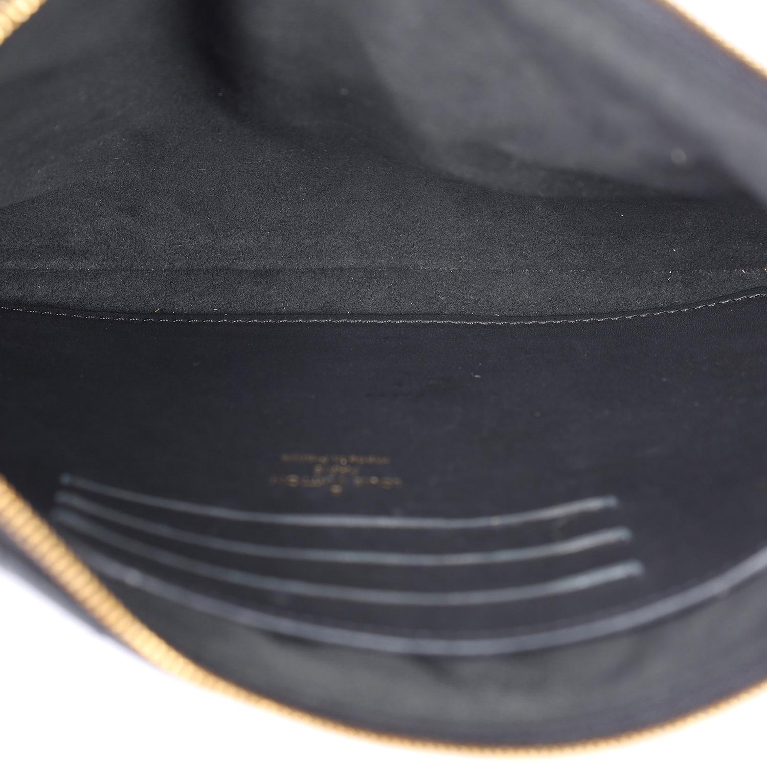 This authentic Louis Vuitton Wave zipped wristlet is crafted from luxurious black calfskin leather, featuring a detachable 7