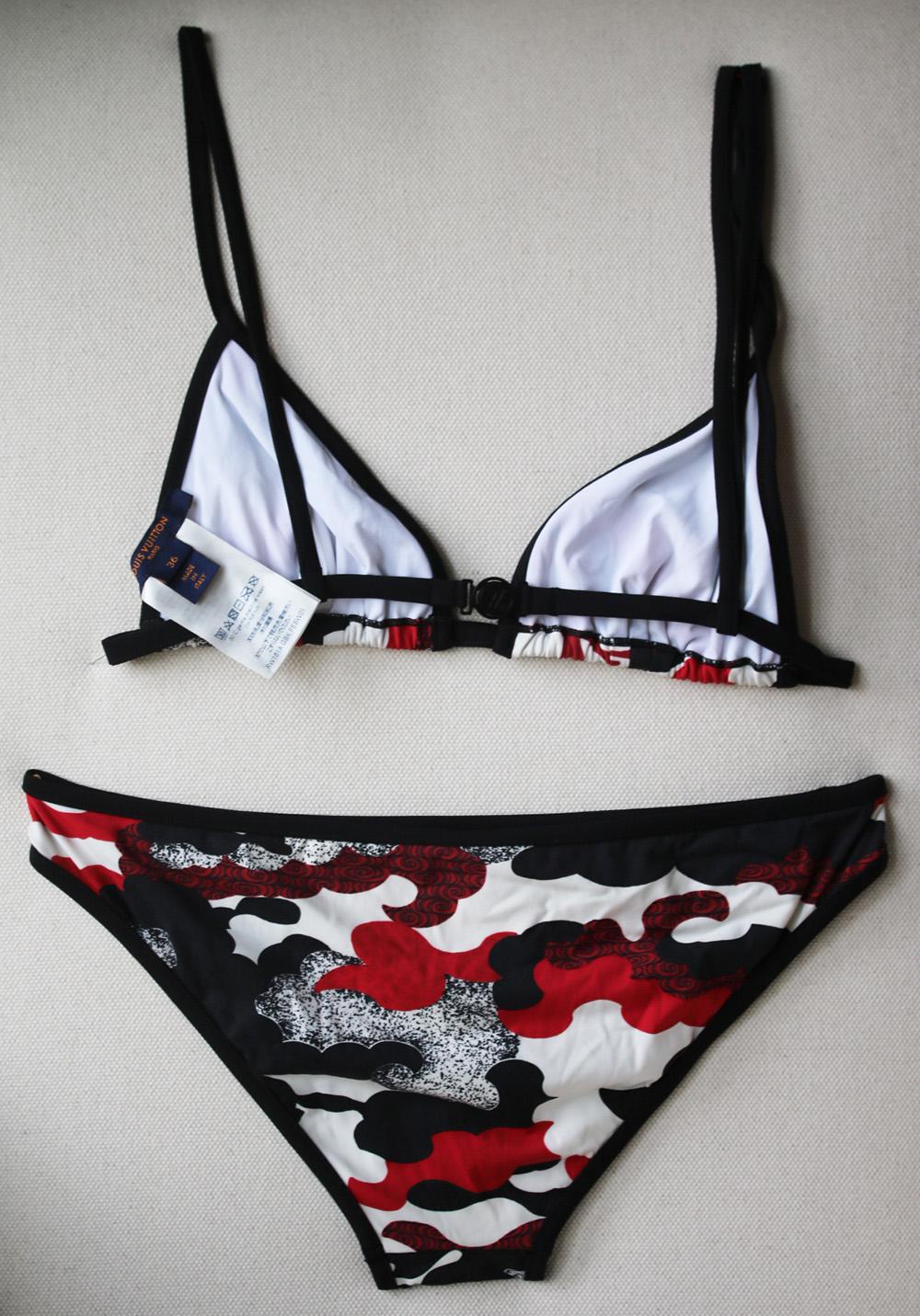 Louis Vuitton's Bikini calls attention to the eye-catching camo-print. The top's classic triangle with cross-over back. This swimwear bottom is crafted from the stencil effect camo-print. 70% Polyamide, 30% Elasthane. Colour: red, black and ecru.