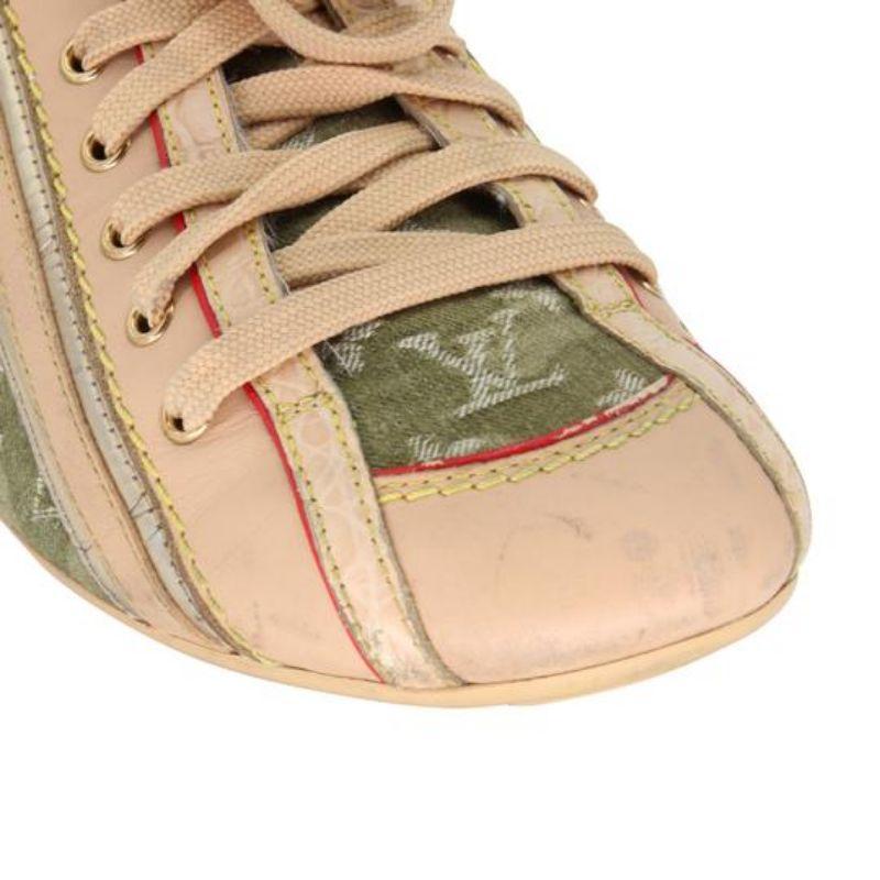 Louis Vuitton Camouflage Rare Metallic & Vachetta 36 Flats LV-S0929P-0297

Hello, ladies here is an extremely rare Louis Vuitton women's athletic sneakers with camouflage detail and elegant metallic detail and sexy red detail with rare vagetta