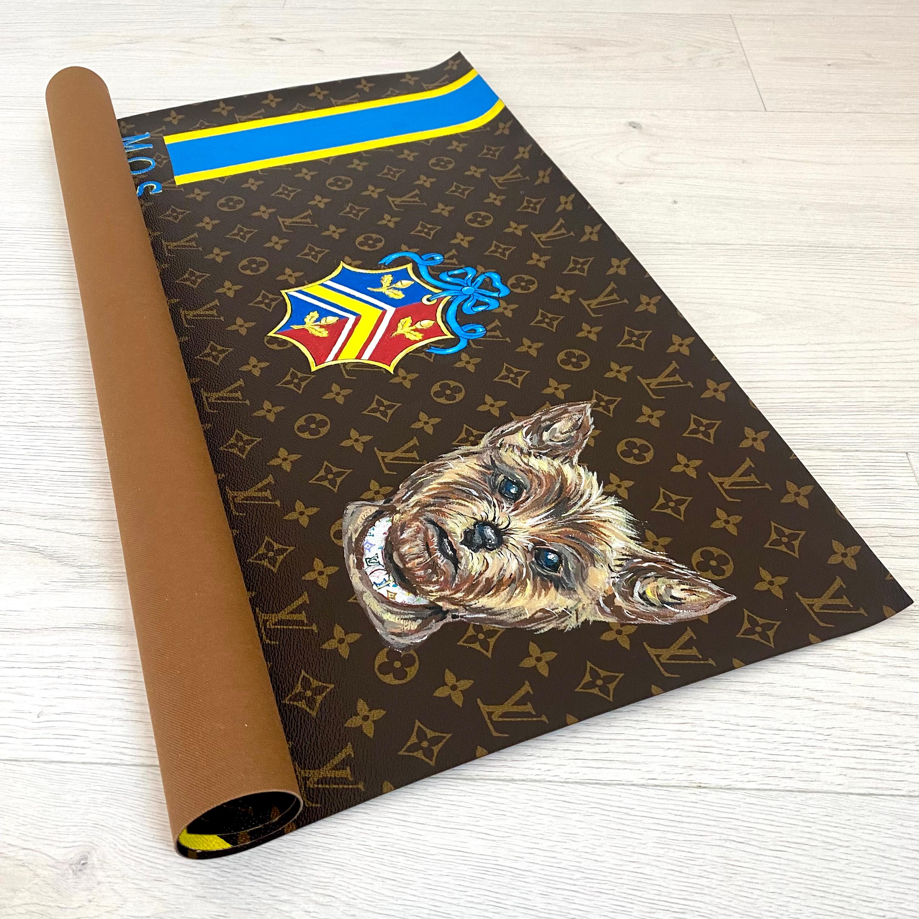 Unusual artwork made on an original piece of Louis Vuitton monogrammed canvas. Hand painted items include an adorable Yorkie with LV collar, Statue of Liberty and initialed lettering. Louis Vuitton was having a contest to hire a new artist, and