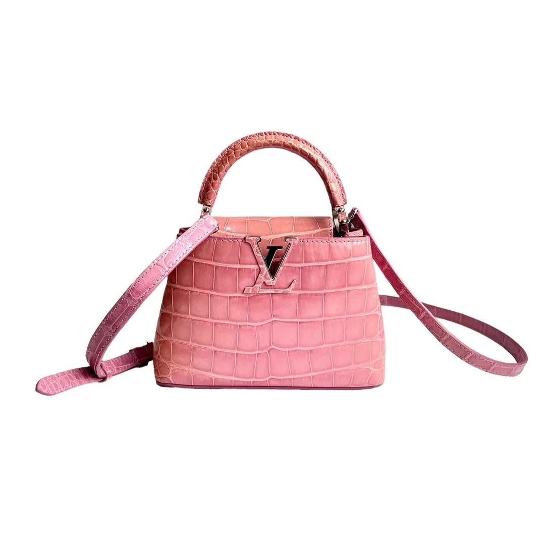 Louis Vuitton Capacines handbag in Pink Alligator  

Condition: Excellent Condition 
Colour: Pink
Box: No 
Dust bag: No 
Material: Crocodile 

This Louis Vuitton Capucines handbag is a stunning and elegant accessory that is sure to turn heads. Made