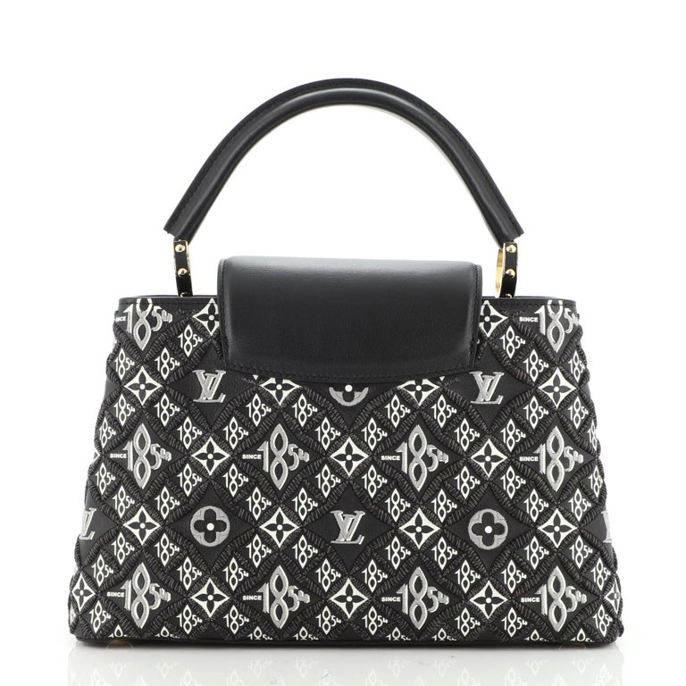 Sold at Auction: Louis Vuitton, A Louis Vuitton Capucine bag in printed  mink and leather, modern