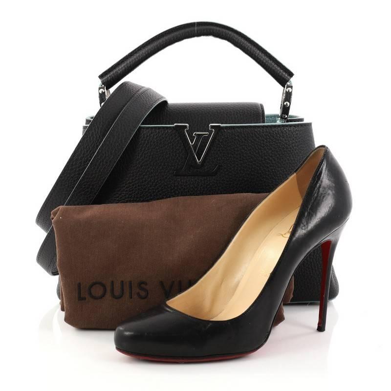 This authentic Louis Vuitton Capucines Handbag Leather BB is sophisticated and fresh in design inspired by its Parisian heritage. Crafted from black taurillon leather, this ultra-chic petite bag features a single rolled leather handle secured by