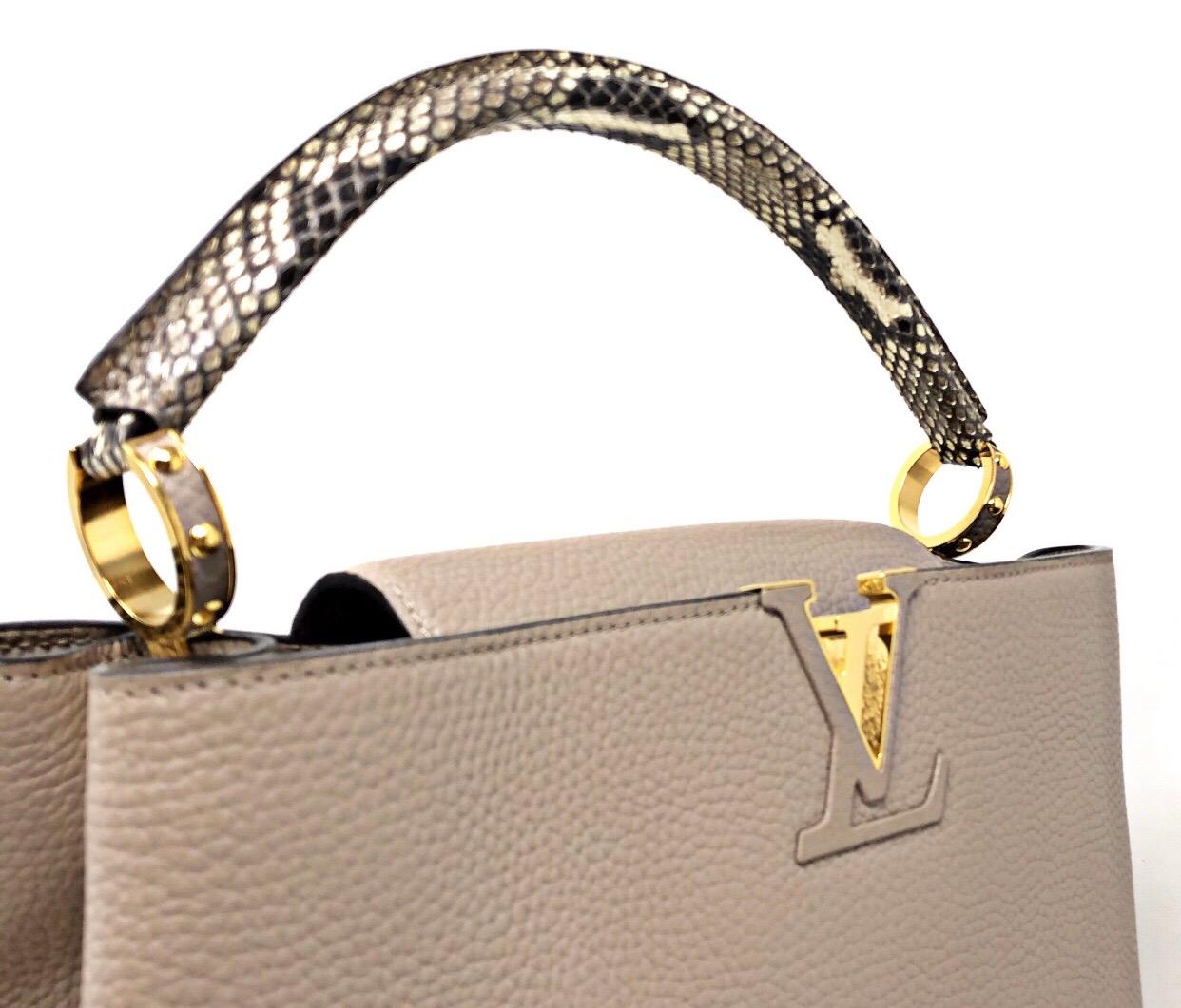 Reali Nice, Capucines bag brings chic sophistication to any look. Full-grain Taurillon leather combines with precious python to create a luxurious handbag accented with heritage details: the LV initials, the distinctive side rings and the subtle