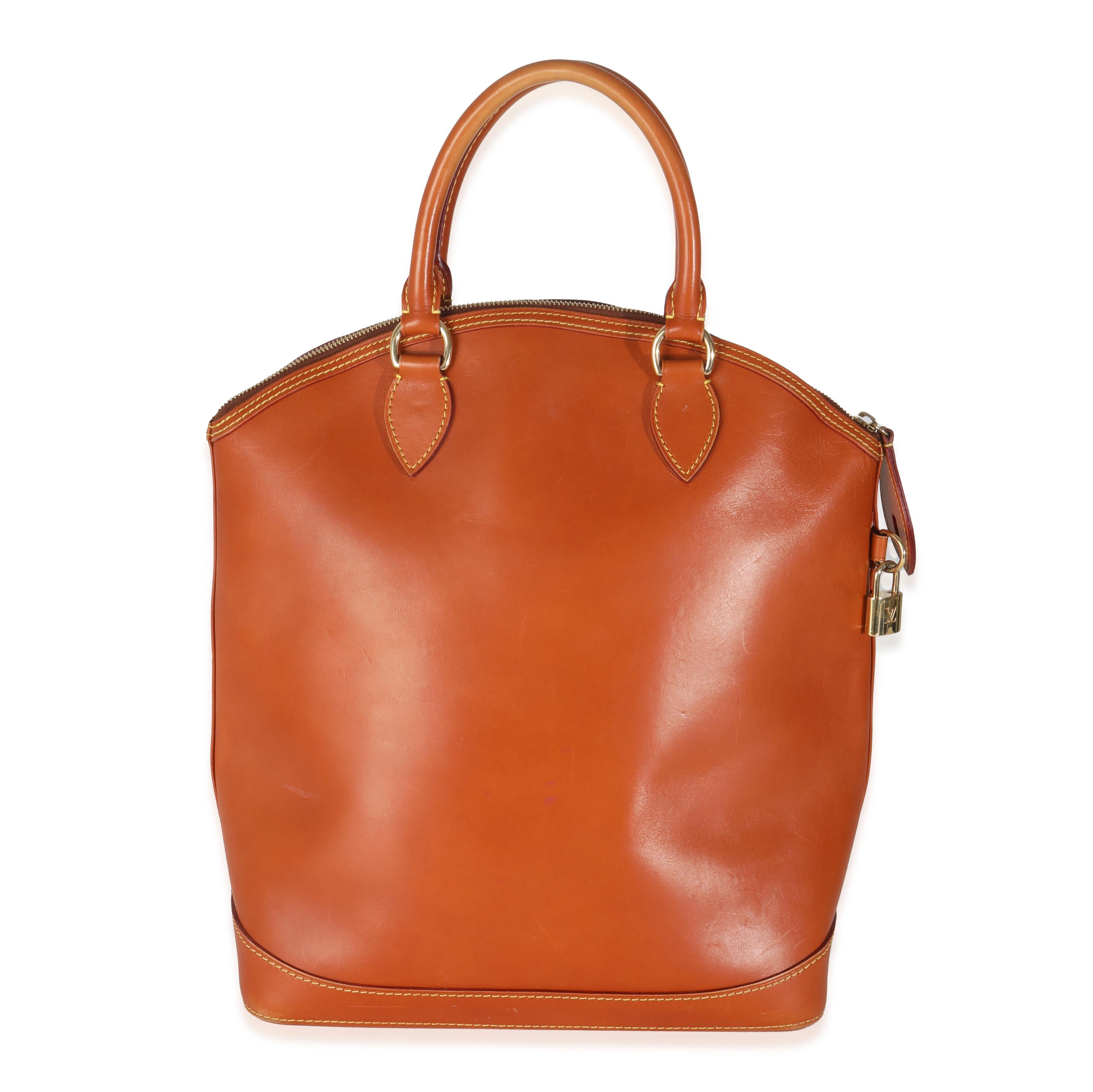Listing Title: Louis Vuitton Caramel Calfskin Nomade Vertical Lockit
SKU: 145170
Condition: Pre-owned 
Handbag Condition: Very Good
Condition Comments: Item is in very good condition with minor signs of wear.  Scuffing along corners. Scratching