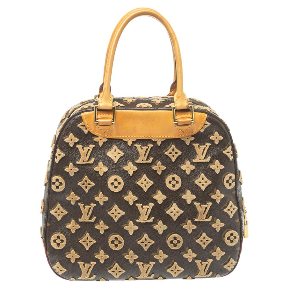 This limited edition bag from Louis Vuitton's Monogram Tuffetage line flaunts the iconic Deauville in a new style. Crafted from the signature canvas using the traditional tufting techniques, the bag is enhanced with 3D monogram accents all over,