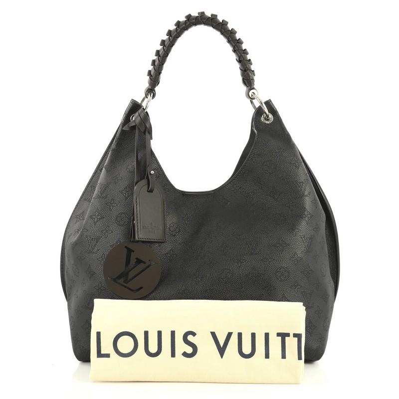 This Louis Vuitton Carmel Hobo Mahina Leather, crafted in black leather, features a braided handle, and silver-tone hardware. It opens to a gray microfiber interior with zip pocket. Authenticity code reads: AH1159.

Estimated Retail Price: