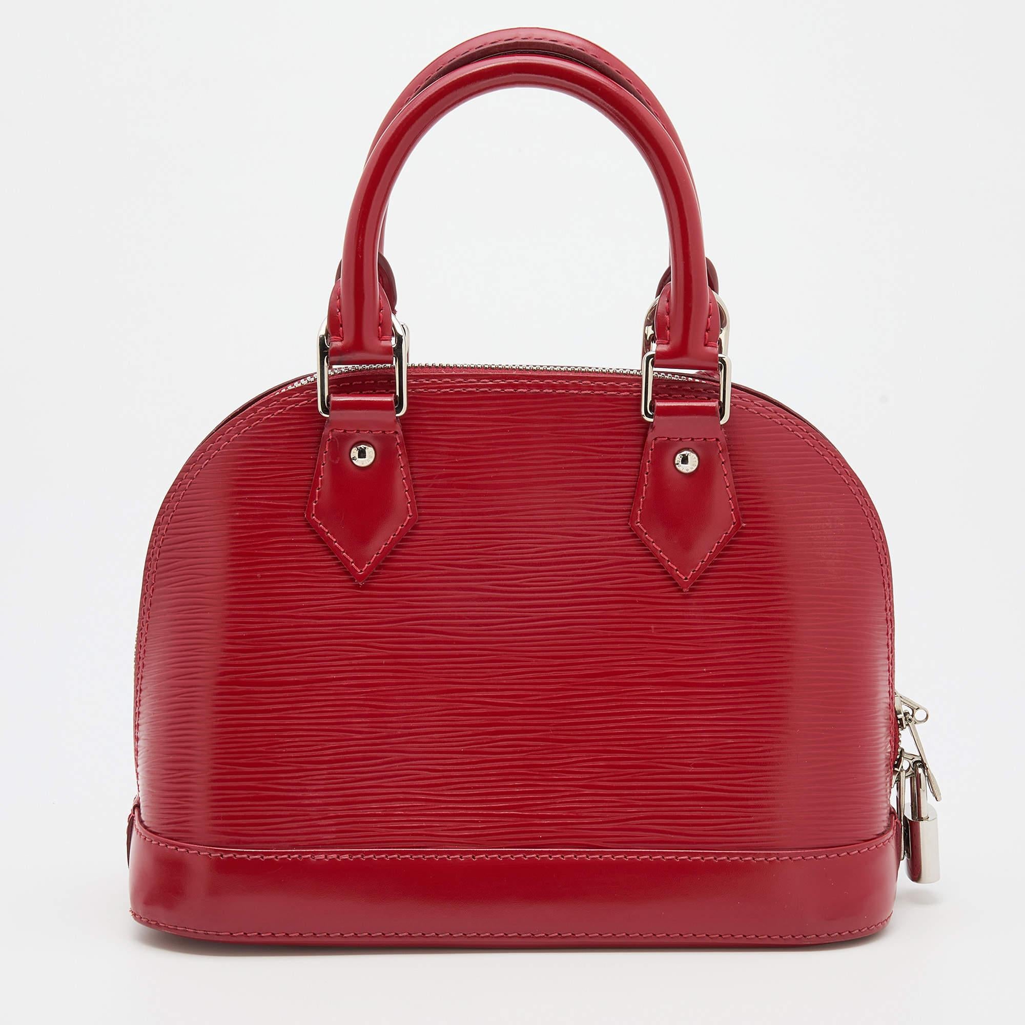 The Louis Vuitton Alma BB comes crafted from Epi leather, featuring double zippers with an Alcantara interior. Two handles and a strap are provided for you to elegantly parade it. Make this Alma yours today! Out of all the irresistible handbags from