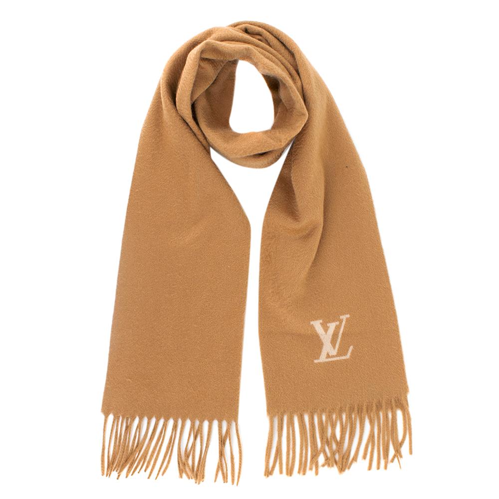 Louis Vuitton Cashmere Camel Scarf 

- Scarf by Louis Vuitton.
- This warm camel brown scarf looks gorgeous and elegant with every outfit and skin tone 
- Light Beige 'LV' initials on the front 
- 100% Cashmere 
- Fringed finish at both ends of the