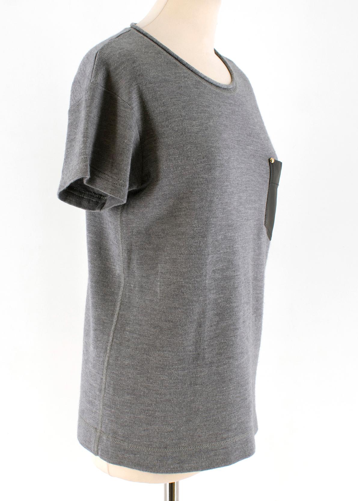 Louis Vuitton leather-pocket cashmere & silk-blend T-shirt

- Grey, soft-touch cashmere and silk-blend jersey 
- Round neck, short sleeves 
- Single black leather patch pocket 
- Golden hardware at the angle of the pocket

Please note, these items