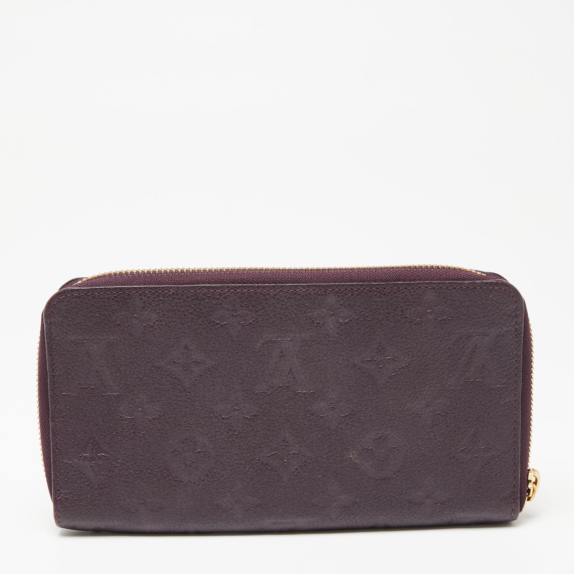 This Louis Vuitton Zippy wallet is carefully designed for everyday use. Crafted from Monogram Empreinte leather, the wallet has a wide zip closure that opens to reveal multiple slots and leather-lined compartments for you to neatly arrange your