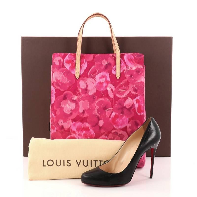 This authentic Louis Vuitton Catalina Handbag Limited Edition Monogram Vernis Ikat North South is a chic and luxurious bag perfect to add to your collection. Crafted from pink printed monogram vernis leather, this sophisticated bag features dual