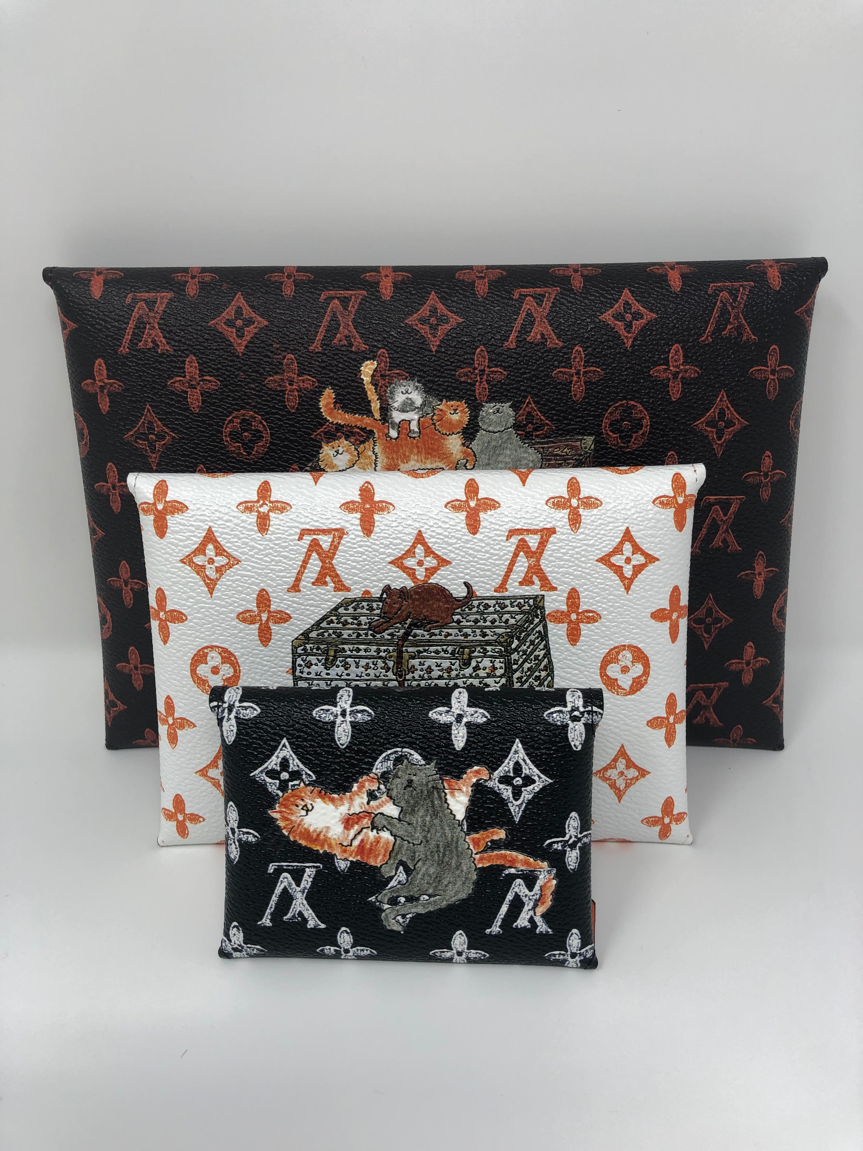 Louis Vuitton Catogram by Grace Coddington Kirigami Set. There are three different size clutch pouches that make this kirigami set. Brand new and very limited. Rare collector's piece. Includes the entire original set with dust cover and box.