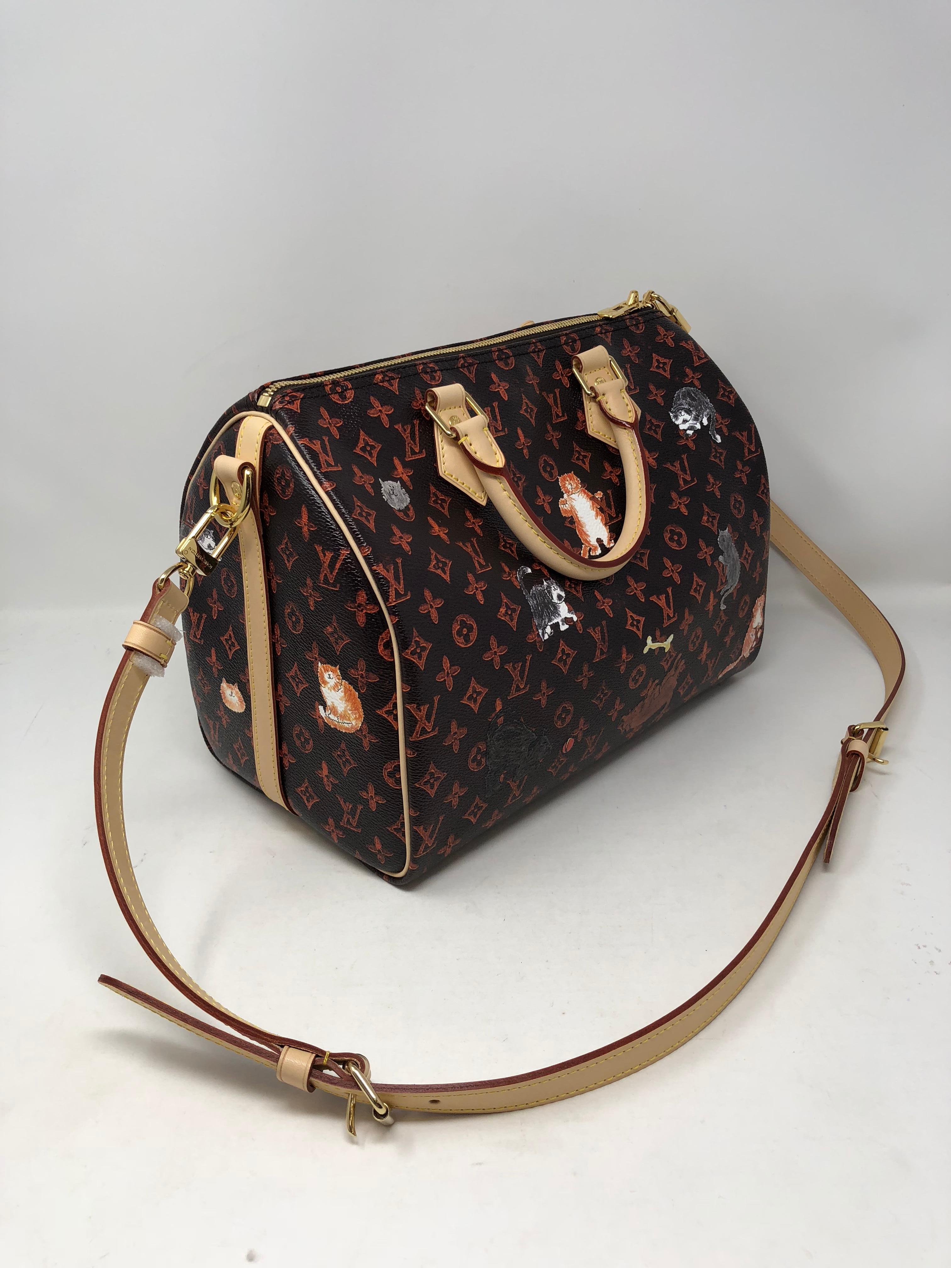 Louis Vuitton Catogram Speedy 30 Bandouliere. Designed by famous fashion editor Grace Coddington with her love for animals. The Catogram is the Must have for any LV collector and lover of cats and dogs. Or as an art piece. This soon to be classic
