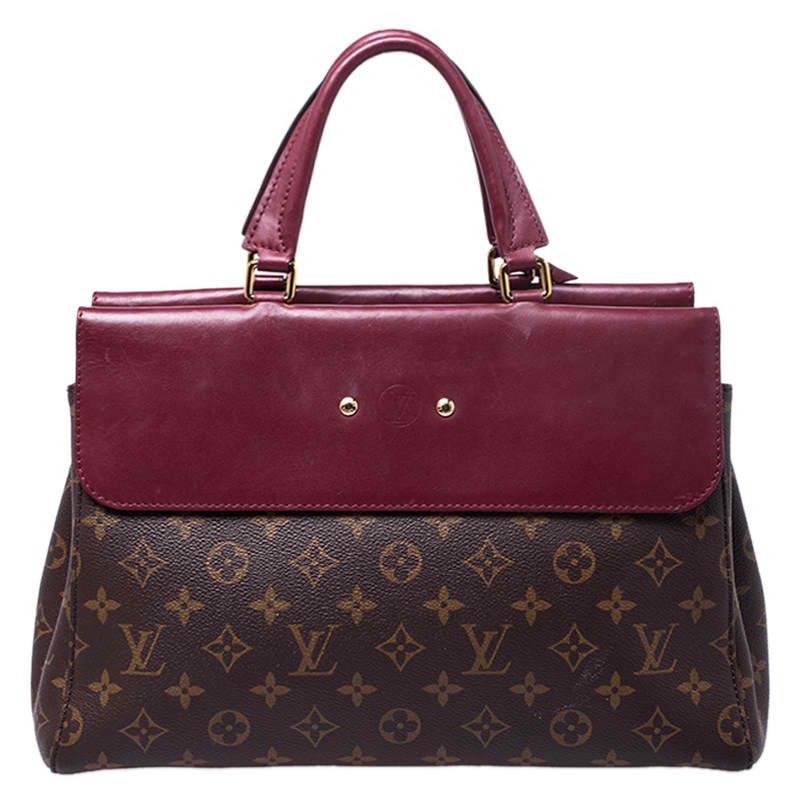 This Venus bag by Louis Vuitton has been crafted meticulously in France and is made from the brand's signature Cerise monogram canvas and red leather. The bag has a structured silhouette and features dual top handles, an Alcantara interior equipped