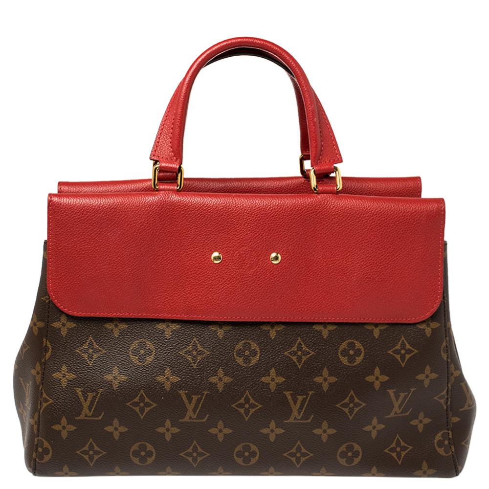 This Venus bag by Louis Vuitton has been crafted meticulously in France and is made from the brand's signature monogram canvas and leather. The bag has a smart silhouette and features dual top handles, an Alcantara interior equipped with two