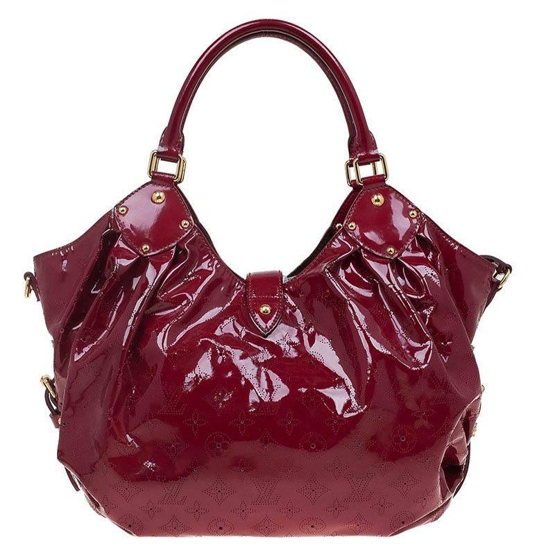 This Louis Vuitton Cerrise bag is designed to be similar to the Mahina nag. Its glossy, red leather body is inspired by the Hindu Sun God, Surya. Feminine and chic, this slouchy bag is roomy and perfect for everyday use. Crafted from intricate