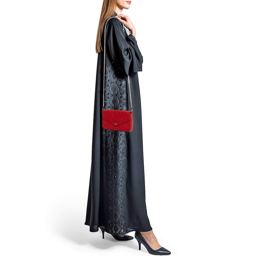 This designer pochette exhibits the brands flair to make chic designs with subdued charm. Made using only prime quality materials  it will look elegant when you carry it nestled under your arm with your favorite outfits.
