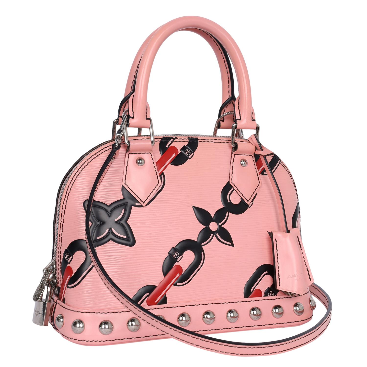 Authentic, pre-loved Alma BB 2Way handbag with Pink Epi leather and detail chain and flower design. Features pink Epi leather, double rolled top handles and a removable shoulder strap, 2 way zip closure, silver tone hardware, black alcantara