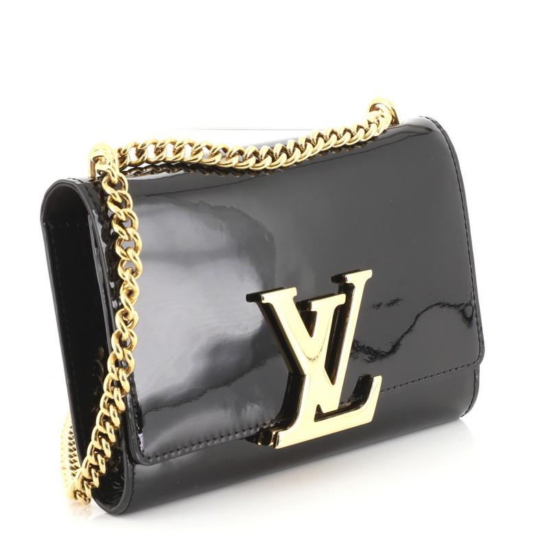 This Louis Vuitton Chain Louise Clutch Patent MM, crafted in black patent leather, features an oversized LV logo flip lock clasp closure, chain link strap and gold-tone hardware. Its flap opens to a black fabric interior with zip and slip pockets.