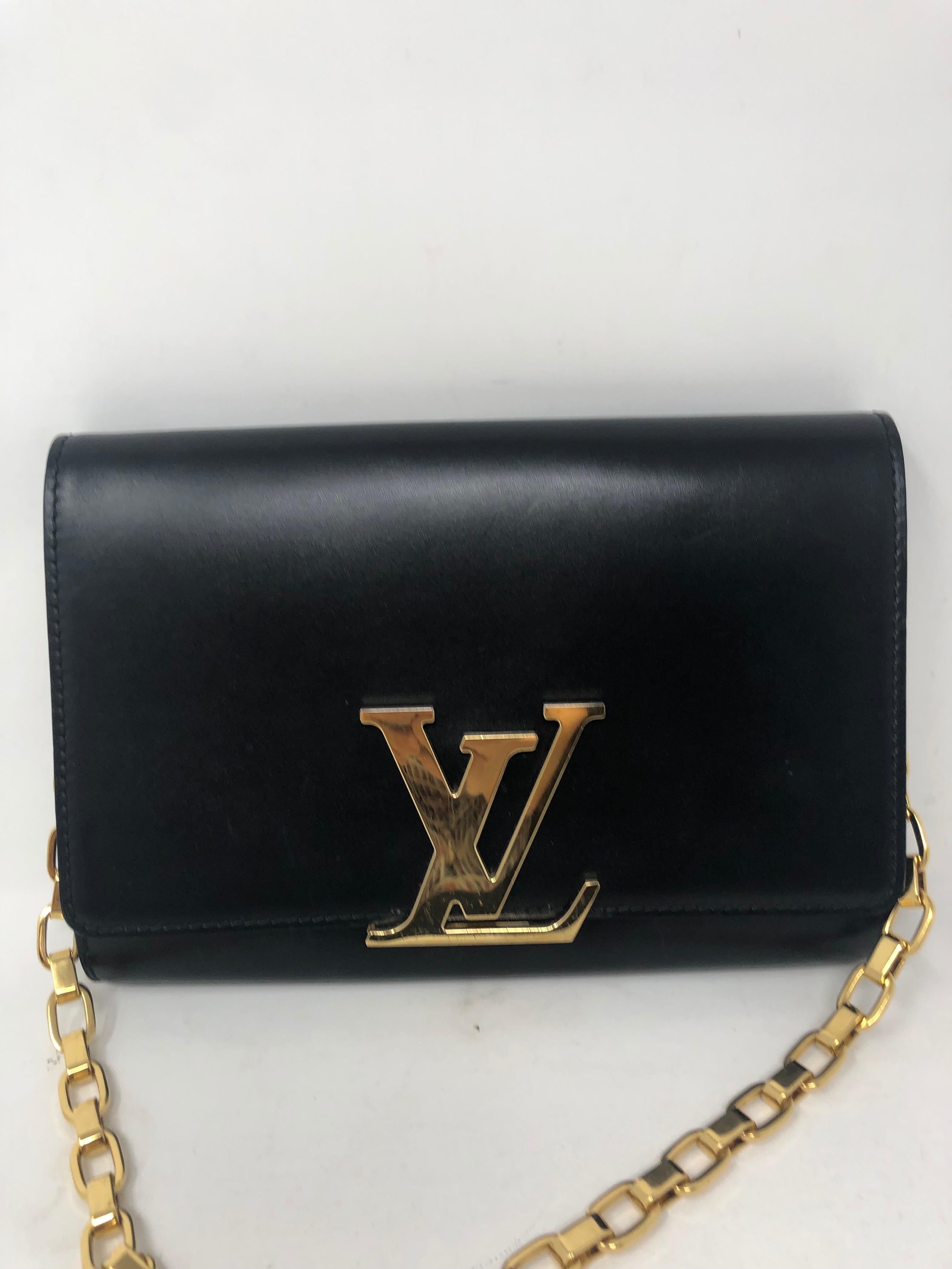 Louis Vuitton Chain Louise GM Black Bag. Black calfskin leather with LV gold hardware clasp and chain. Chain can be worn as a shoulder bag or tucked in as a clutch. Good condition. Light surface scratches on the hardware. Minimal wear.  Leather is
