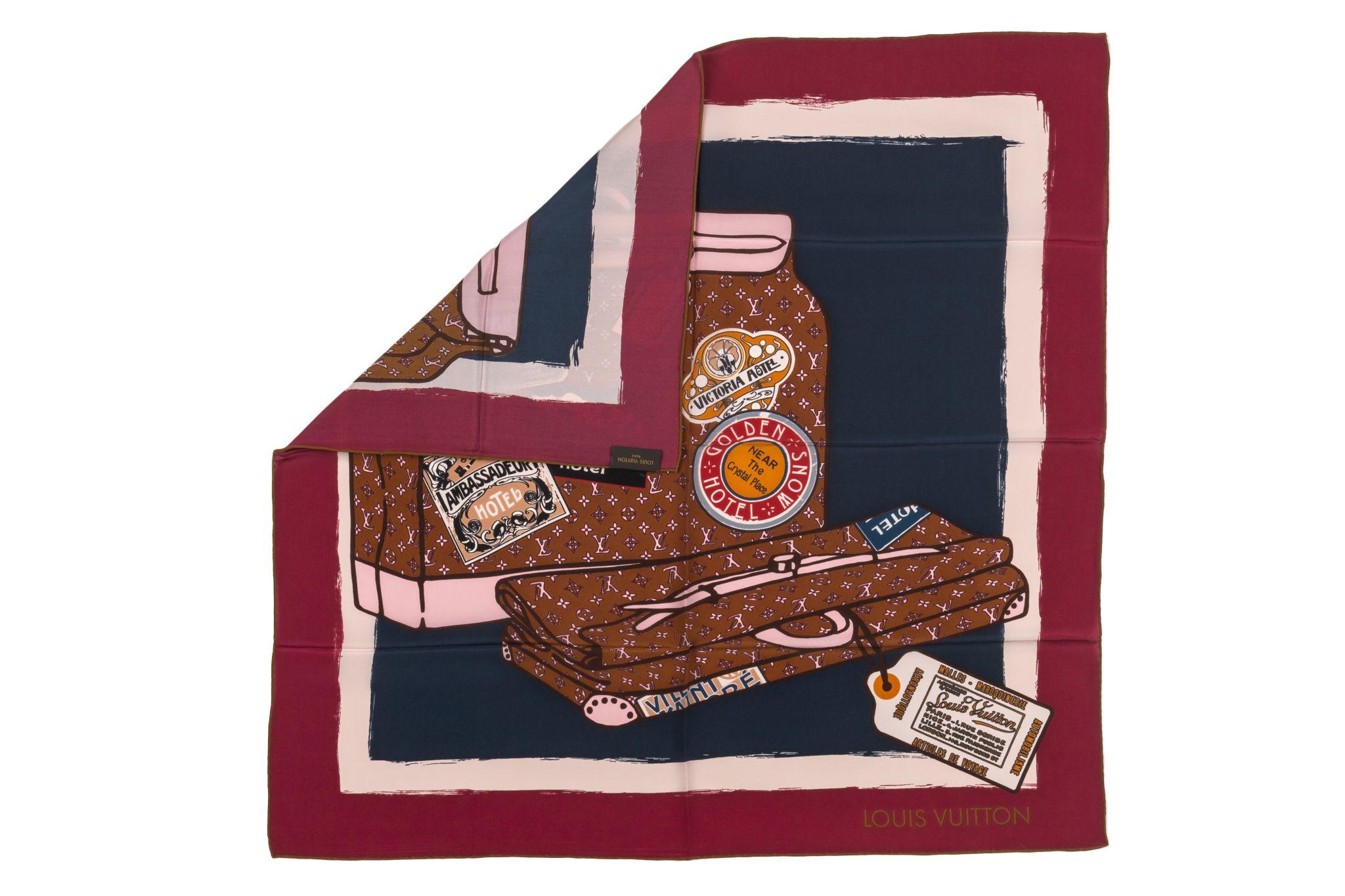 Louis Vuitton Chale Monogram Silk Scarf. The scarf is printed with a luggage themed pattern. The edges are burgundy and rolled. The piece is in unworn condition.