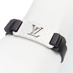 LOUIS VUITTON Champs Elysee black leather floral motif LV metal plate bracelet