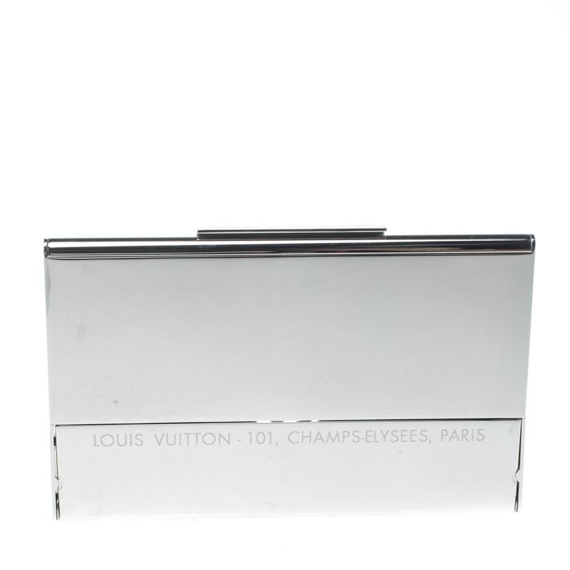 This wonderful card holder finds inspiration from the wall at Louis Vuitton's Champs-Elysées store, and we must say it's stunning! It is made from palladium-finish metal and engraved with monogram flowers and an LV laser cut on the front.

Includes: