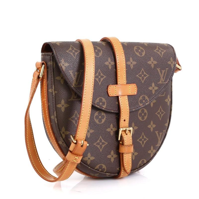 This Louis Vuitton Chantilly Handbag Monogram Canvas MM, crafted in brown monogram coated canvas, features adjustable leather strap, frontal flap and gold-tone hardware. Its buckle closure opens to a brown leather interior with zip pocket.