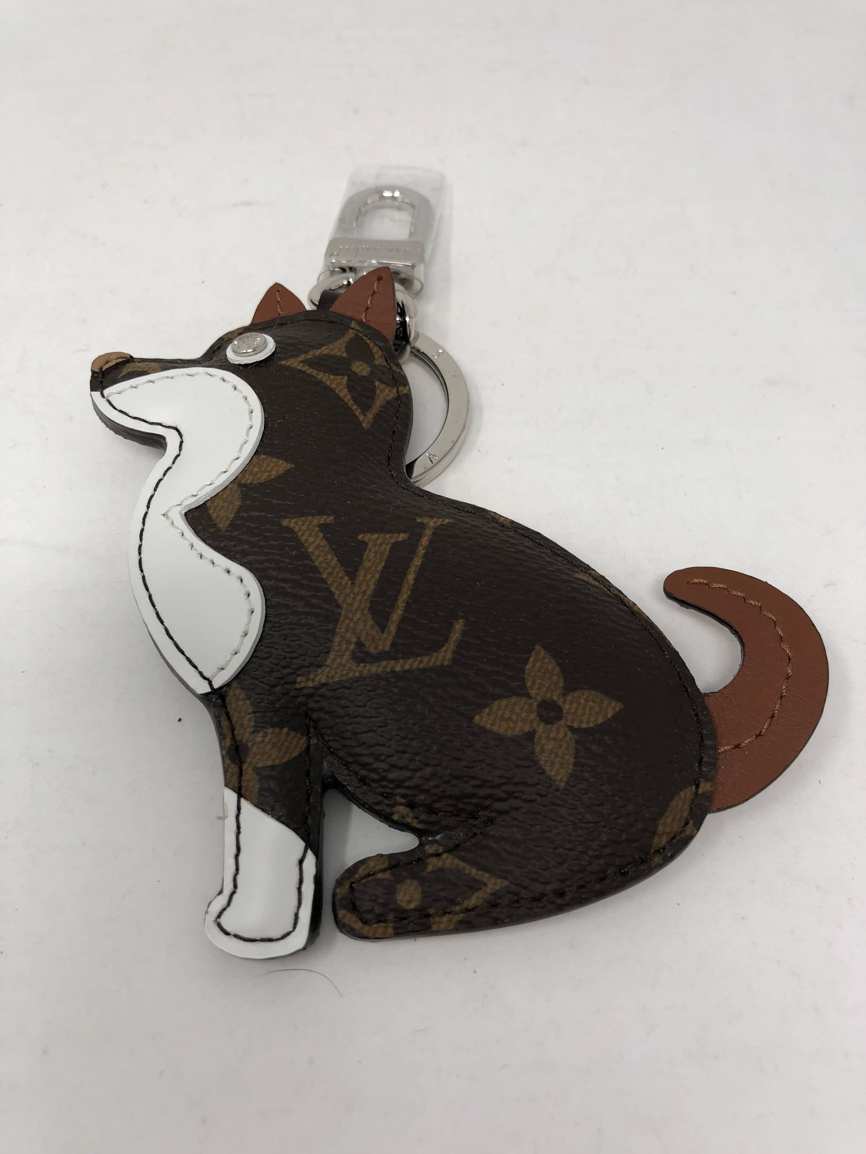 Louis Vuitton Dog Charm and Key Holder with monogram canvas and calf-leather trim. Eye made with a trunk stud. Sold out and limited edition. Part of a collection that celebrates the Chinese Zodiac. Brand new from 2018 and comes with dust cover and