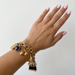 Louis Vuitton Armband mit Charme aus 18 Karat Gelbgold mit Diamanten und Rubinen