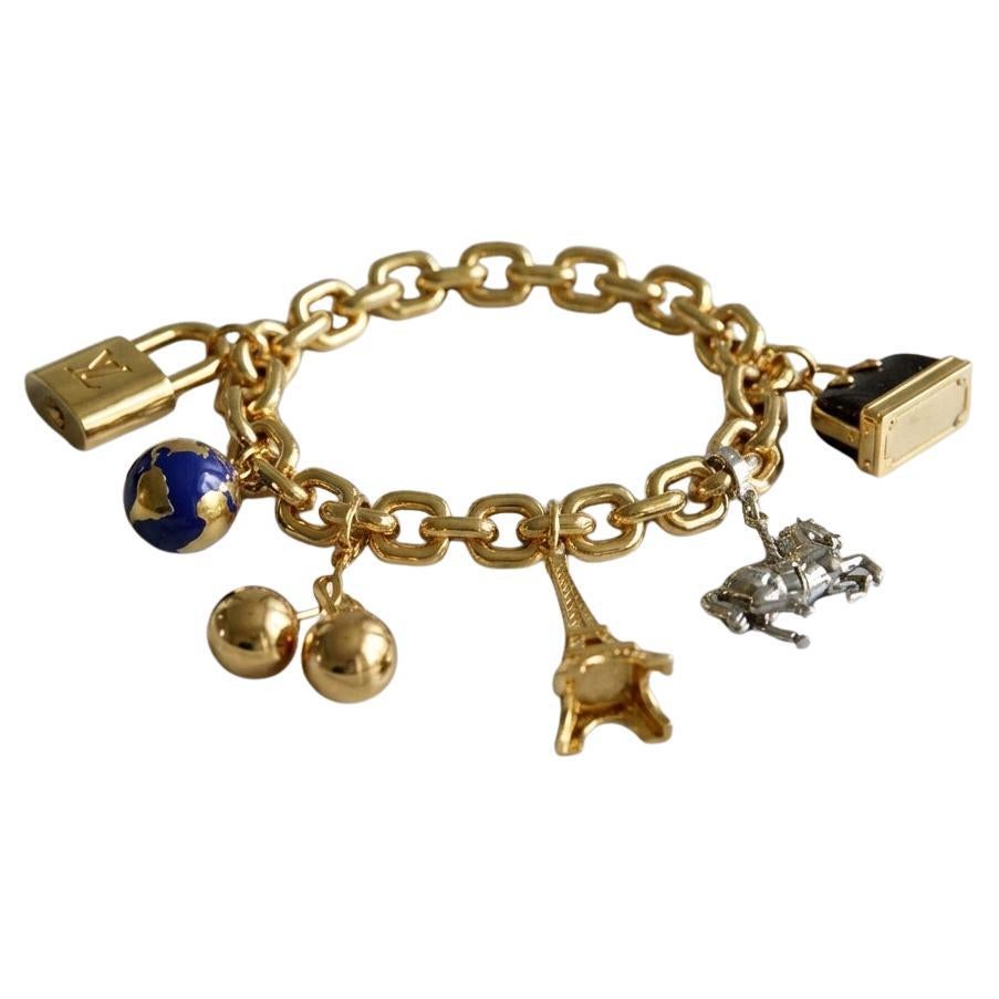 Louis Vuitton Armband mit Charme aus 18 Karat Gelbgold mit Diamanten und Rubinen