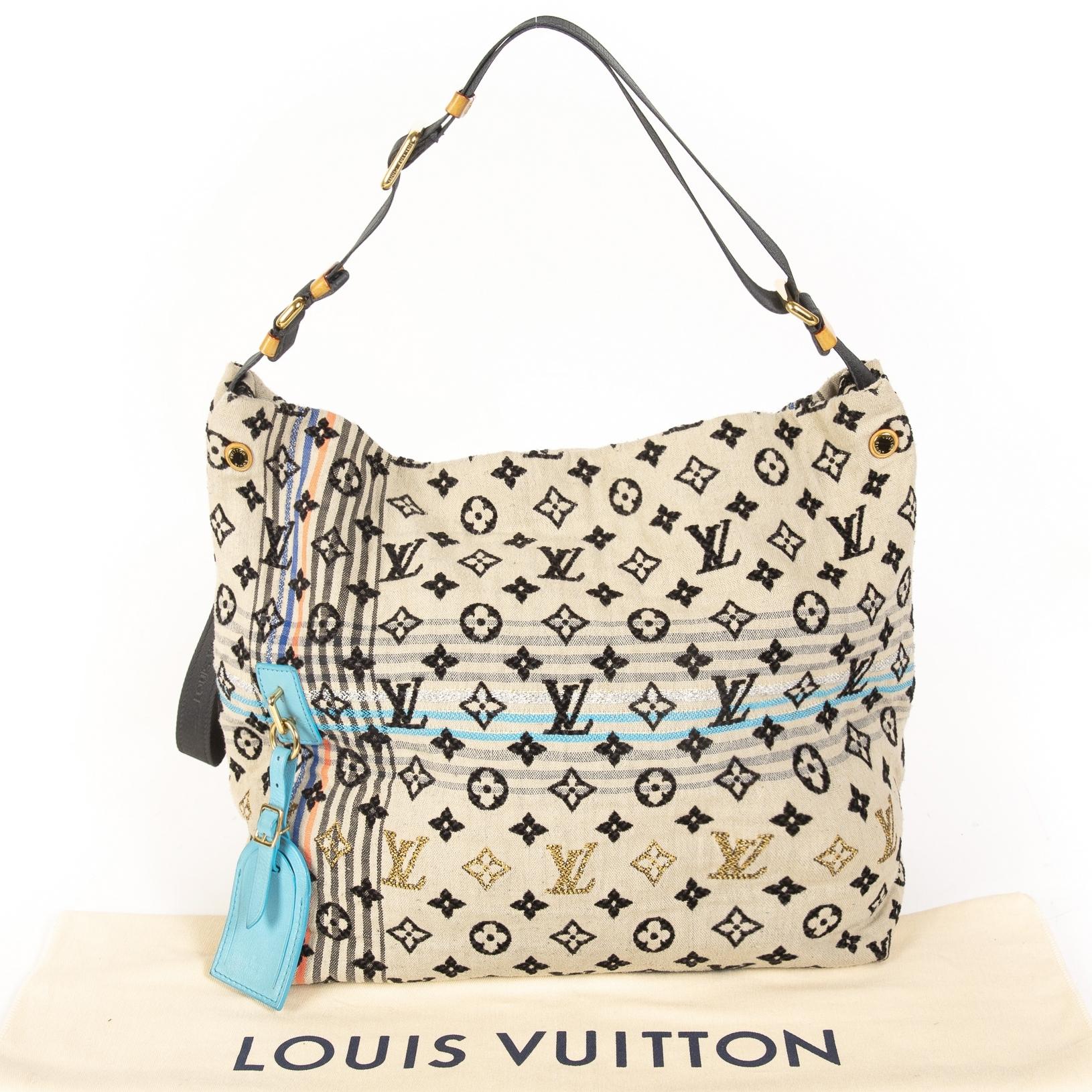 In good condition

Louis Vuitton Cheche Bohemian Tote Bag

This bag is a limited edition from the Spring/Summer 2010 collection. Beige and black monogram jacquard woven Louis Vuitton Cheche Bohemian bag with blue, silver and pink details. Comes with