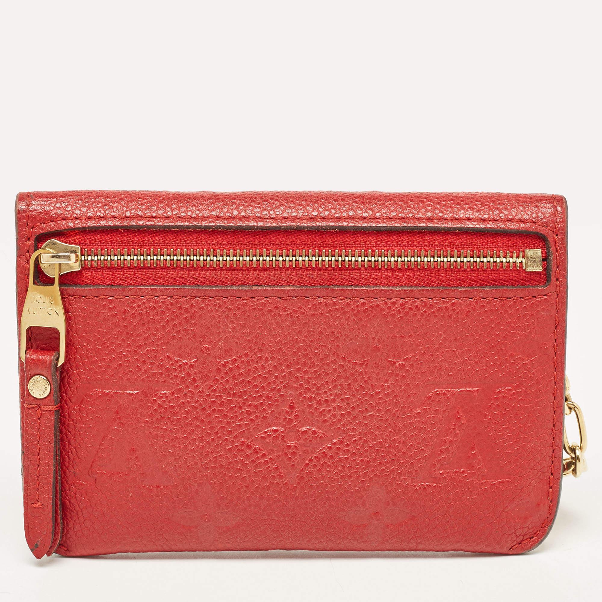 This classic key pouch by Louis Vuitton is your perfect choice when it comes to looks and utility. It doesn't fall short with a perfectly crafted Cherry Empreinte leather. It has a well-spaced interior where you can keep all your keys. It's a