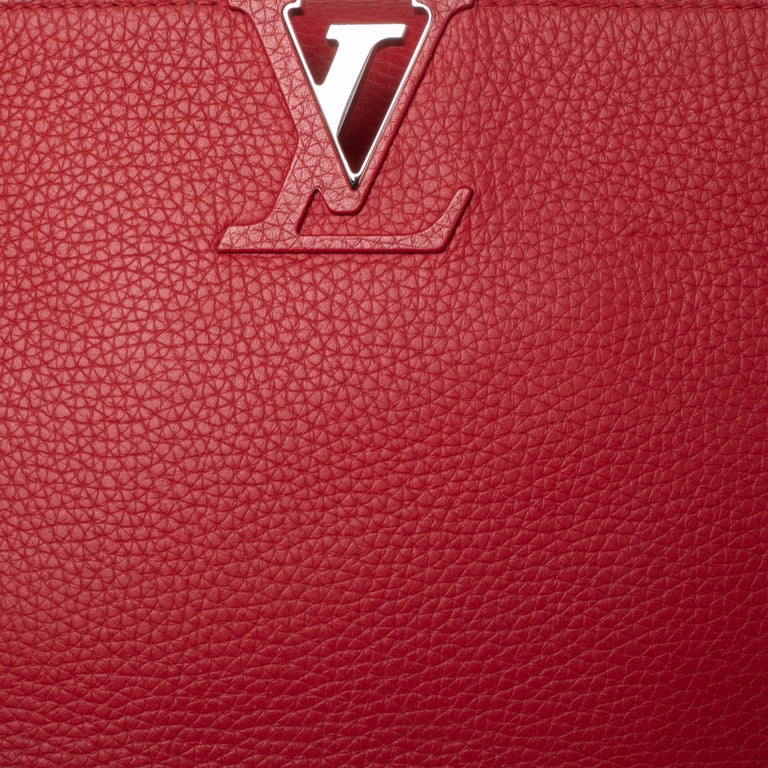 And Owns the Louis Vuitton Capucines Bag in Cherry Red
