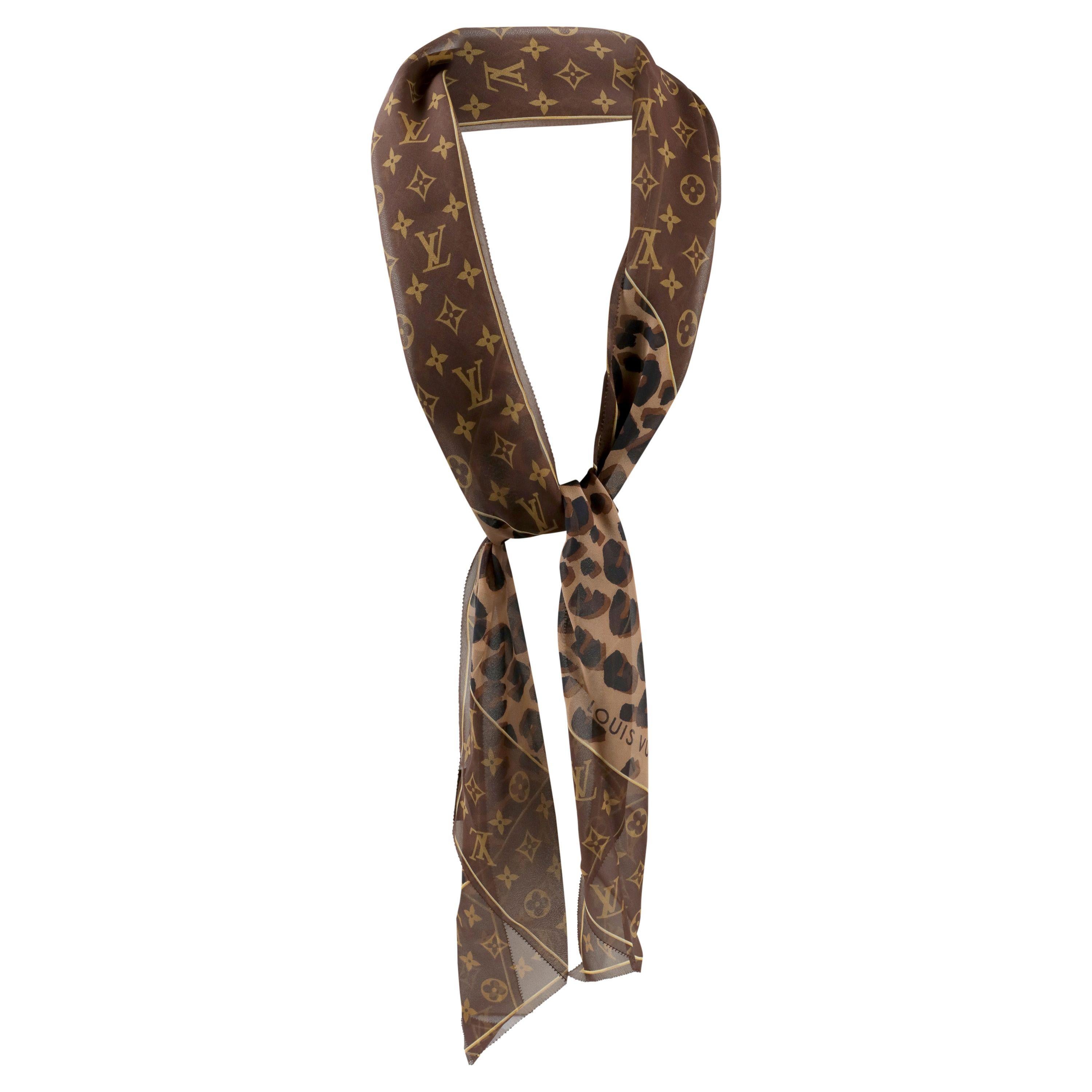 This authentic. Louis Vuitton Chiffon Cheetah Skinny Scarf is pristine.  Signature brown and tan LV monogram is incorporated with coordinating animal print.  Made in Italy.  
PBF 13927

