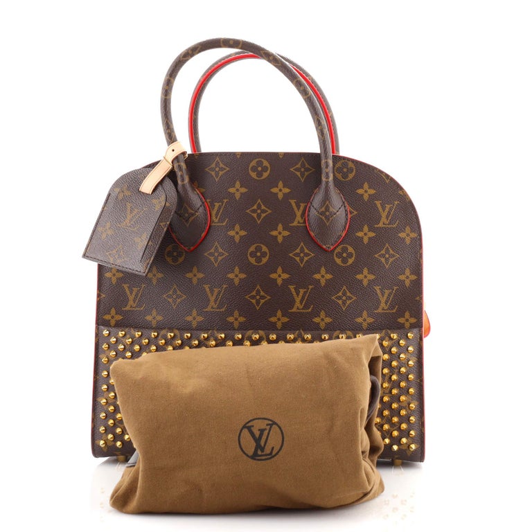 Louis Vuitton bag full of Christian Louboutins