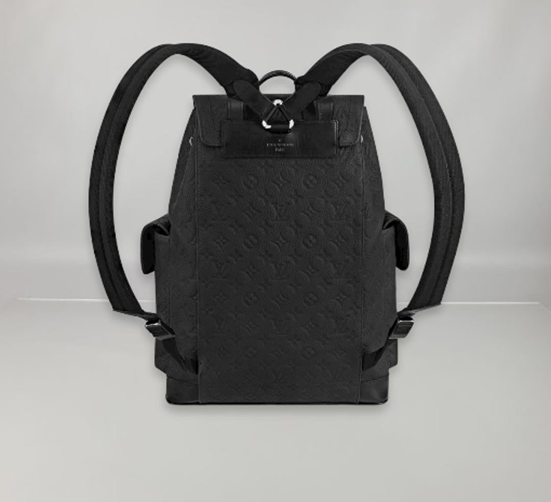 The Christopher MM backpack is a medium-sized model that features two exterior side pockets and several very practical interior pockets. It's made of Taurillon leather with the engraved Monogram motif, and it shows off matte black metal pieces. It