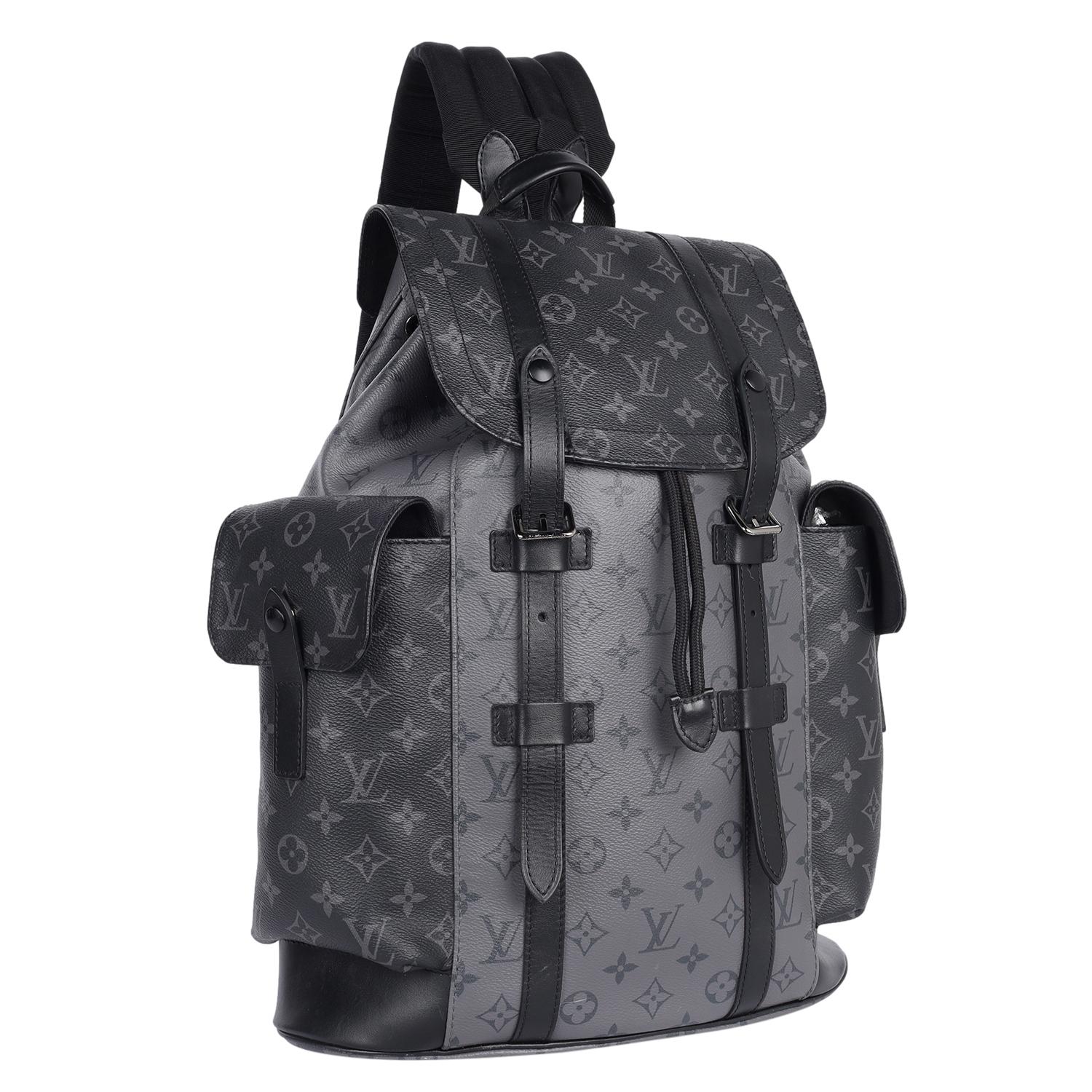 Authentic Louis Vuitton Christopher Monogram Eclipse backpack. Features Monogram eclipse coated canvas exterior, smooth black cowhide leather trim, silver tone hardware,  adjustable web shoulder straps, leather top handle, exterior pockets with push