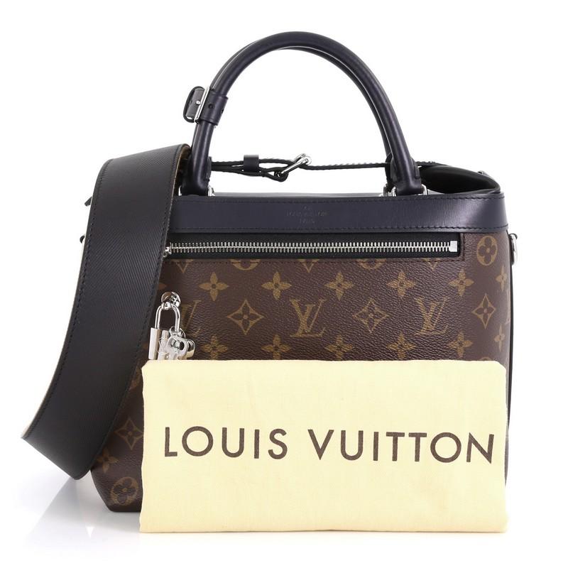 This Louis Vuitton City Cruiser Handbag Monogram Canvas and Leather PM, crafted from brown monogram coated canvas and black leather, features dual-rolled handles, exterior front zip pocket, and silver-tone hardware. Its zip closure opens to a black