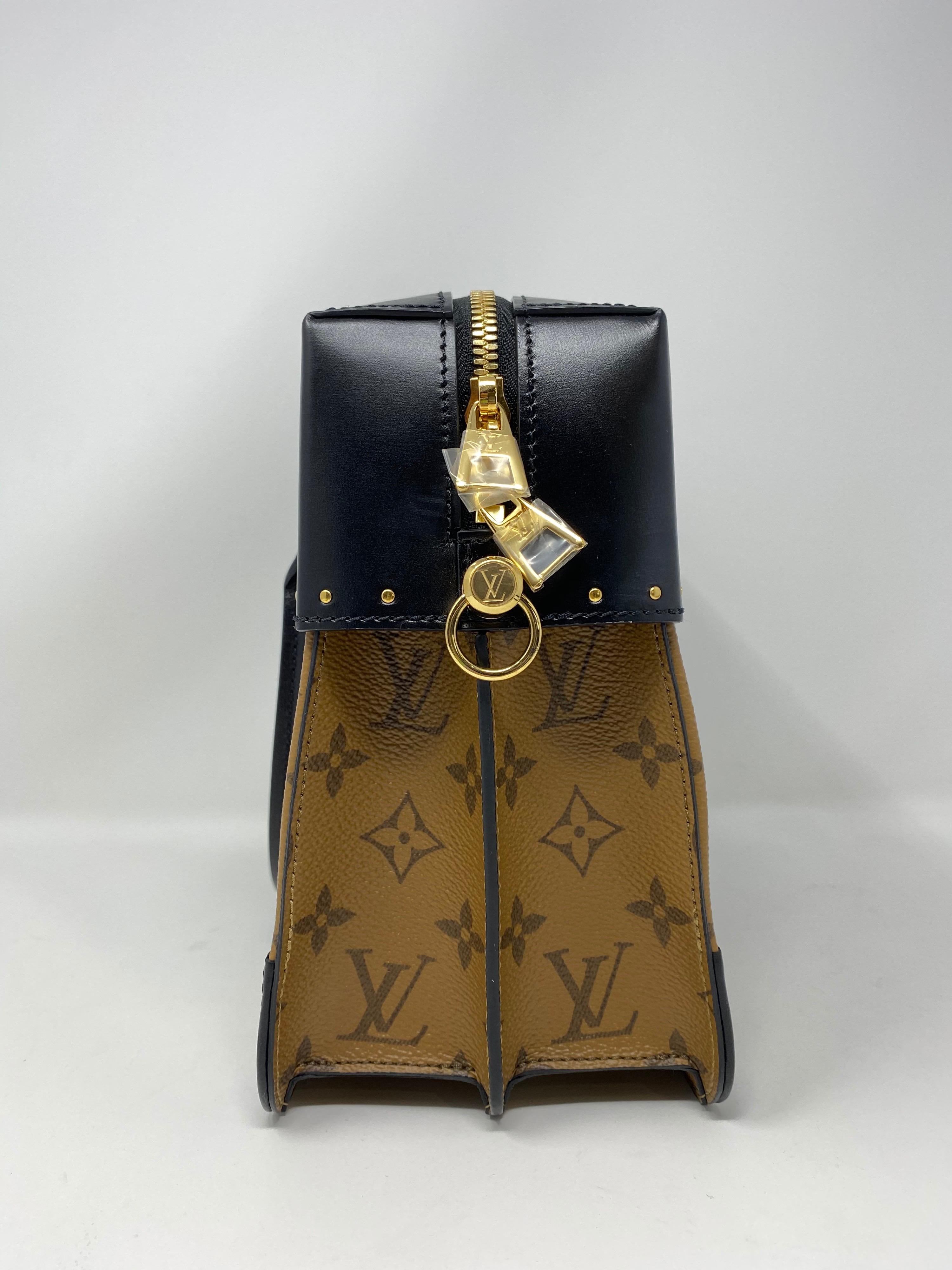 Louis Vuitton City Malle Bag. New condition. Limited and rare bag. Reverse LV and black leather. Unique combo with black leather strap. Guaranteed authentic. 